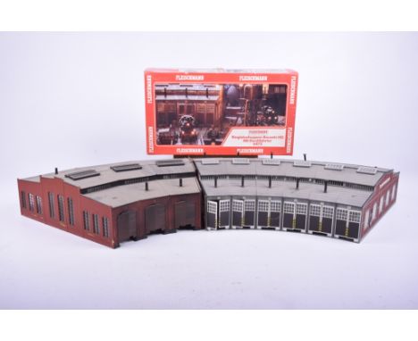 An unboxed German HO gauge curved six rail engine shedAnd a boxed Fleischmann HO gauge unmade engine shed no. 6475, and an ot