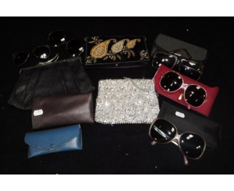 FOUR PAIRS OF VINTAGE SUNGLASSES, c.1970's including a Polaroid example. Together with three evening bags to include a black 