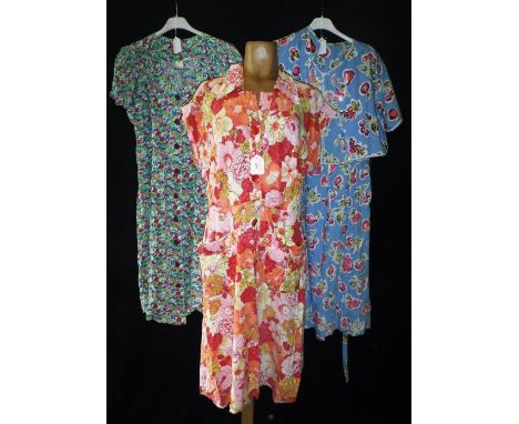 A SHORT COTTON DAY DRESS WITH BUTTON FRONT circa 1950s and two similar dresses (3)