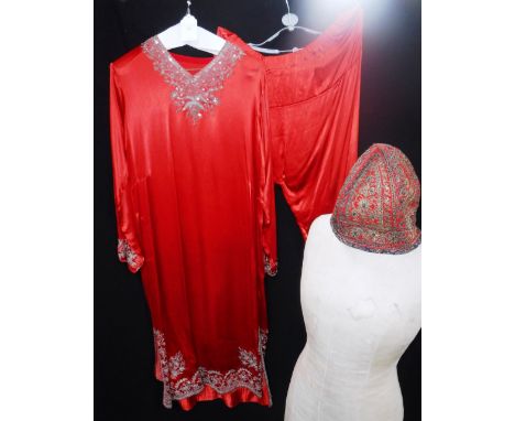 A PAIR OF VINTAGE RED SATIN INDIAN STYLE PYJAMAS with sequin and embroidered detail to neckline, cuffs and hem, and a matchin