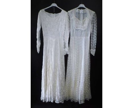 A VINTAGE CREAM NET DECORATED WEDDING DRESS and another similar