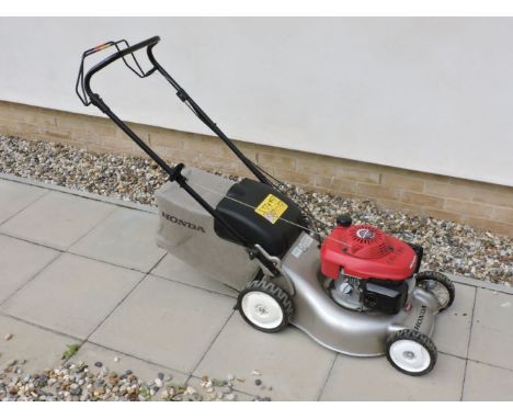 A Honda 'ISY' start petrol rotary mower, with 12in cut