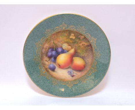 A Royal Worcester porcelain plate, the central roundel painted with pears and grapes, signed R Sebright, within a mottled gre