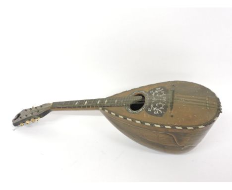 A Florentine tortoiseshell and mother of pearl inlaid mandolin, dated 1922 and labelled F del Perugia, 61cm long