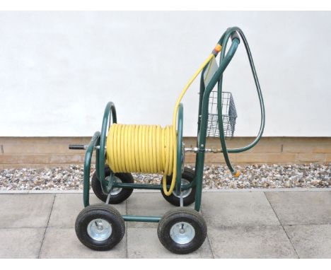 A four wheel hose pipe trolley, with hose pipe