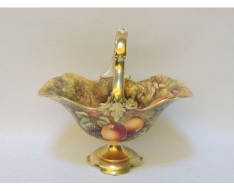 A Royal Worcester porcelain basket on stand, with looped handle over, decorated inside and out with hand painted fruit and gi