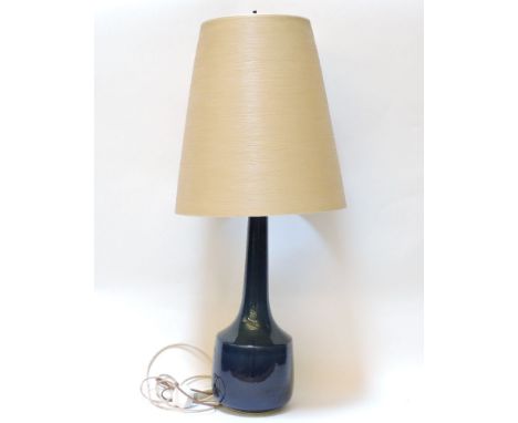 A blue glazed pottery table lamp, with conical shade
