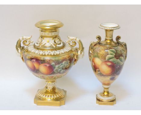 A Royal Worcester porcelain vase, with scrolling mask handles to either side and decorated with parcel gilt and fruit study, 