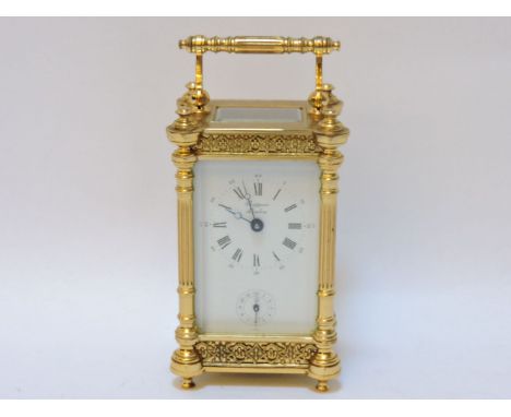 A brass carriage clock, by Rapport, London, 15cm tall
