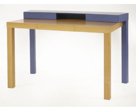 A contemporary maple and blue lacquer writing desk, with two drawers flanking a shelf over a frieze drawer