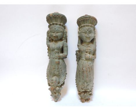 A pair of carved wooden Eastern architectural elements