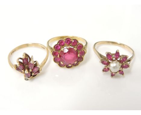 A gold synthetic ruby cluster ring, marked 18ct, a gold ruby and diamond spray ring marked 18k 585, and a 9ct gold half cultu