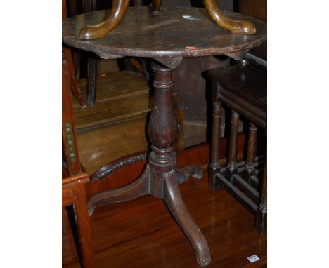 A Georgian style oak fixed top pedestal tripod table; together with a George III oak hinge-top pedestal tripod table (2)