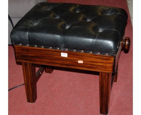 A simulated rosewood and studded leather button back upholstered piano stool
