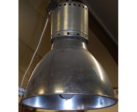 A contemporary aluminium industrial hanging ceiling light, having domed shade