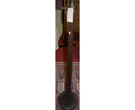 A lacquered wood standard lamp of fluted form 