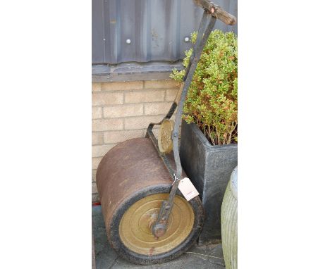 An early 20th century wrought and cast iron garden roller by The Gamage, Holborn 
