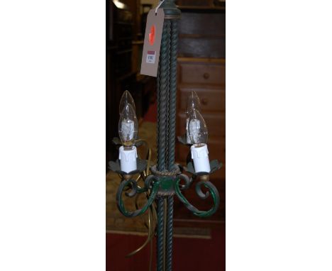 A pair of green painted metal four light standard lamps, each of spiral turned form 