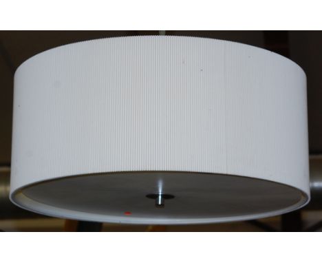 A contemporary chromed metal circular hanging ceiling light, having a frosted glass shade
