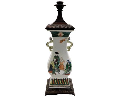 A Chinese porcelain famille verte two handled baluster vase, of rectangular section, with serpentine handles and decorated wi