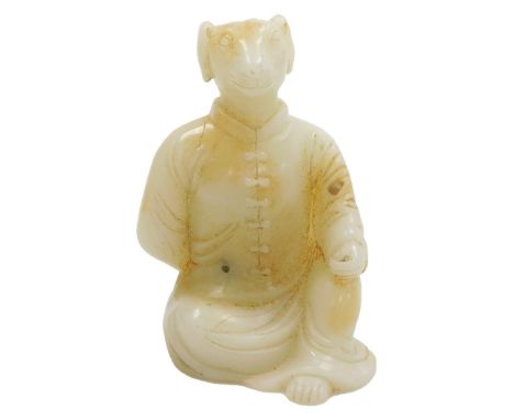 A 19thC or earlier Chinese jade carving of a seated man, dressed in a tunic and wearing an animal mask, 15cm high. 