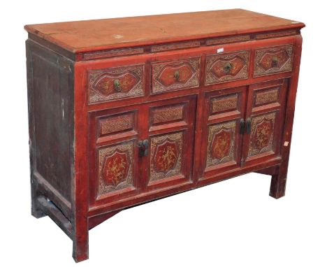 A Chinese red lacquered side cabinet, with an arrangement of drawers and cupboards, 96cm high, 125cm wide, 46cm deep. 