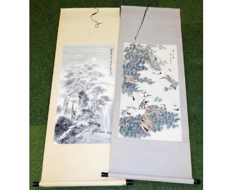 A Chinese scroll painting. Depicting cranes in pine branches, wash, inscribed, signed and seal to the upper right, 49cm wide,