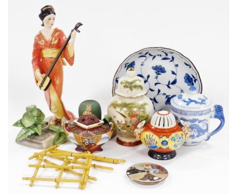 A group of Japanese and Chinese porcelain and pottery, including a Satsuma koro and cover, vase and cover, figure of a Japane