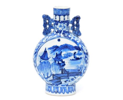 A Chinese blue and white porcelain moon flask, decorated to both sides with panels of buildings in landscapes, within a flora