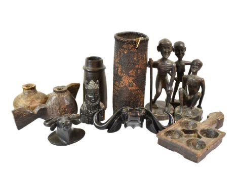 A Small Collection of Ethnographica, including a Yaure mask with painted features, a game board, an ebonised figure group of 