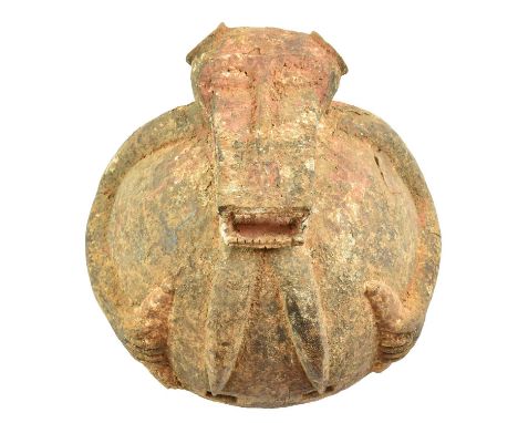 A Senufo Monkey "Fire Spitter" Type Helmet Mask, covered in a textured ochre/cream pigment, 28cm diameterCondition report: Le