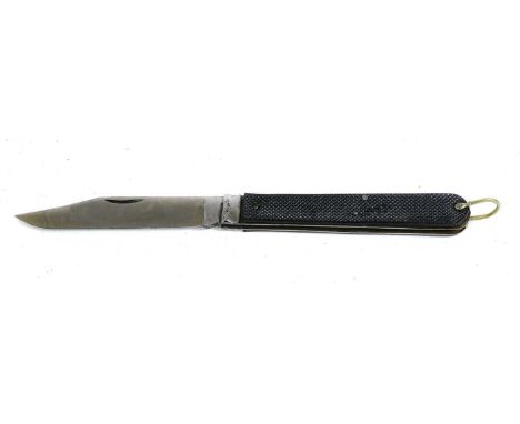 A Second World War Special Operations Executive Folding Knife, with 14cm plain clip point steel blade, chequered black plasti