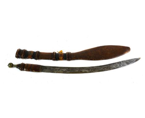 A West African Fulani Sword, the 55cm single edge slightly curved with narrow fuller, the leather bound grip with brass globu