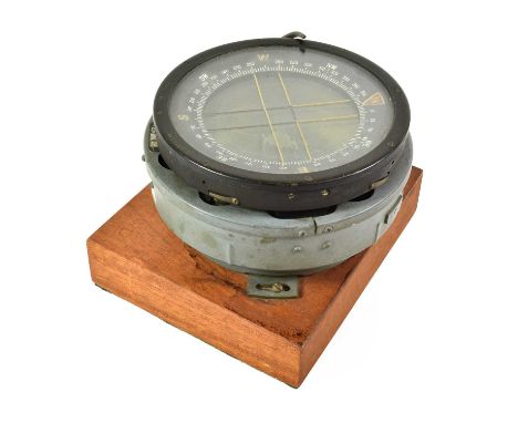 A Second World War Type P10 Aircraft Compass, numbered 27948 8, stamped with broad arrow, on a later teak plinth