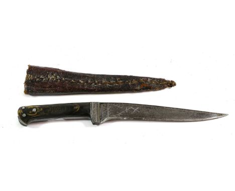 A Late 19th Century Indo-Persian Kard Dagger, the 19cm single edge downswept curved steel blade with wrigglework decoration t