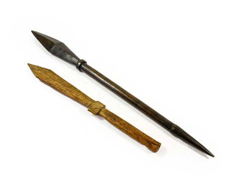 A Tongan War Club, of dark stained hardwood, with elongated diamond section head, ring collar and cylindrical haft with stepp