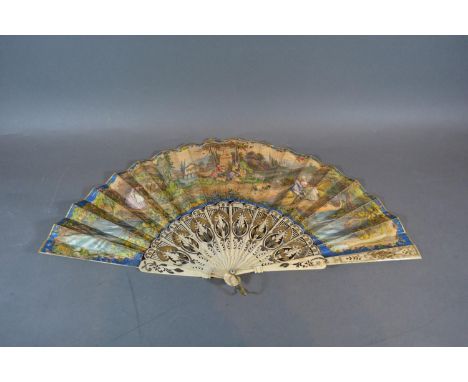 A Mid 19th Century Austrian Fan with pierced and gilded bone guards and sticks with coloured lithograph leaf and with origina