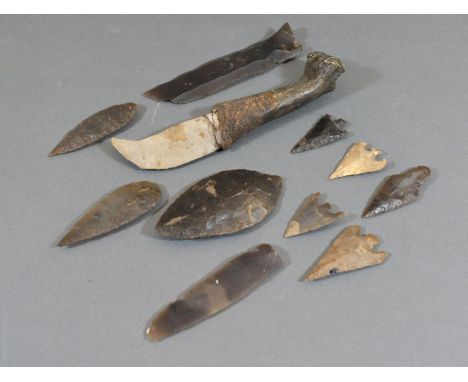 A Collection of Neolithic Arrow Heads and Implements 