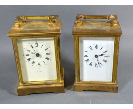 A Brass Cased Carriage Clock with Enamel Dial inscribed Mann with lever escapement, 12cm tall together with another similar b