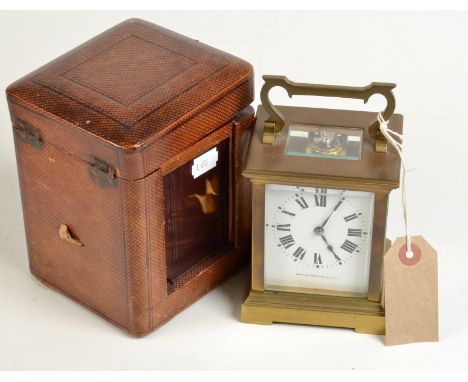 A large French brass carriage clock by R & Co, retailed by the Bristol Goldsmiths Alliance, height 12cm, leather travelling c
