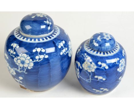 Two Chinese porcelain prunis pattern, blue and white ginger jars, the small jar with Kangxi four character mark to base, larg