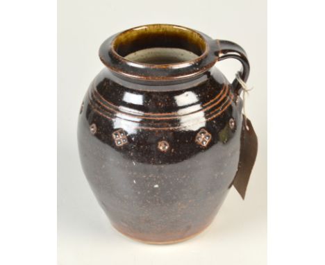 A Jim Malone temoku vase with small handle and impressed decoration, height 15.5 cm.