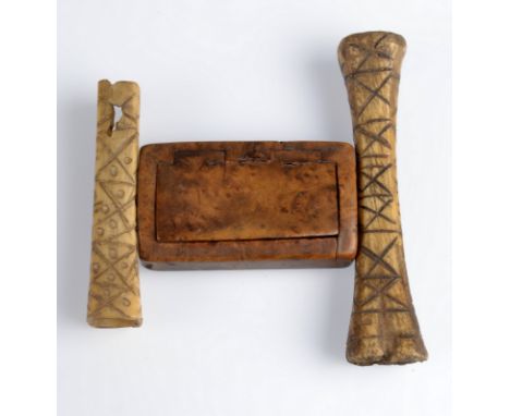 A burr wood snuff box and two geometric decorated bones, possibly for calculating. 