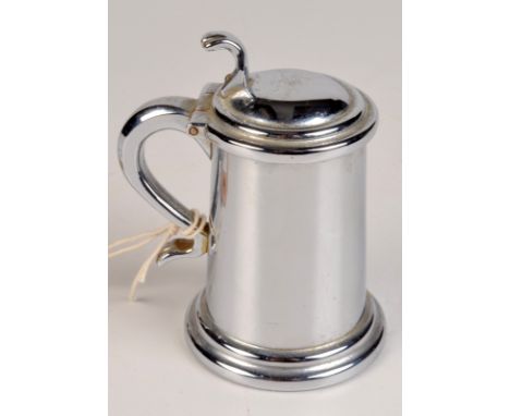 A Dunhill plated table lighter made as a lidded tankard with thumb piece operation.