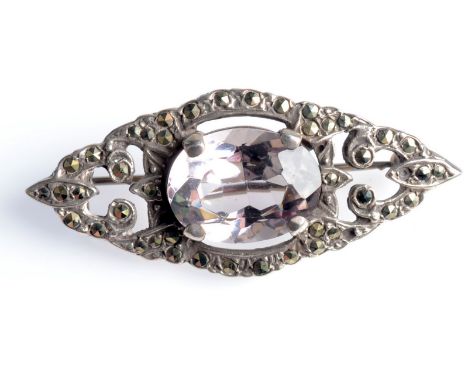 A silver and marcasite brooch set a pale amethyst, length 4.5cm.