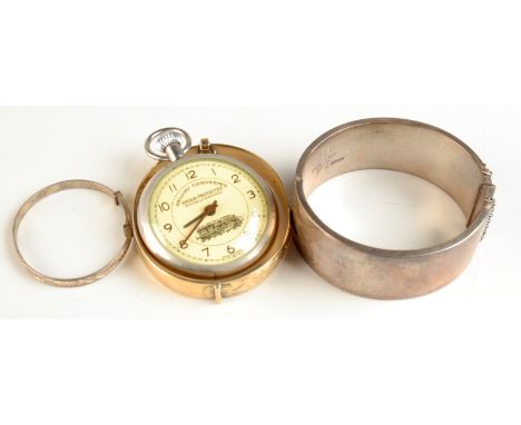 A modern "Railway Timekeeper", together with a silver bangle and two other bangles.