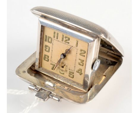 An Art Deco silver purse watch of square form with engine turned decoration, hallmarked Birmingham 1933. 