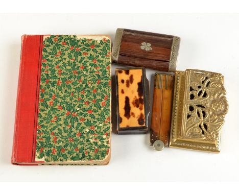 Two snuff boxes, a folding ivory rule, a brass stamp box and a book.