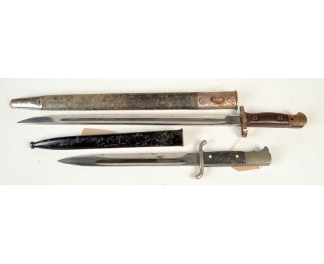 An early 20th century Wilkinson bayonet dated 1907 with leather and nickel sheath, full length 57cm, together with a German f