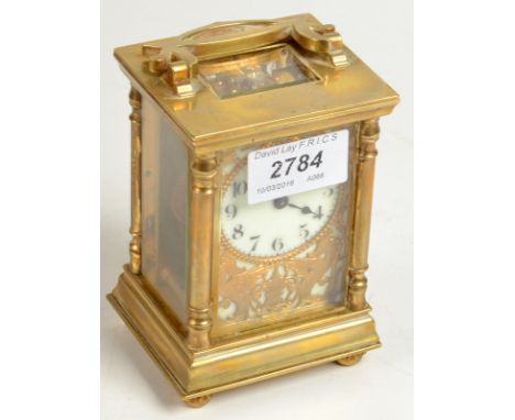 A brass carriage clock, the dial in a pierced bird and leaf surround, height 11.5cm. Condition Report: Replacement lever esca
